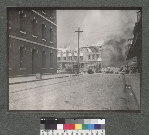 [Unidentified building in flames, wholesale district. Appraiser's Building (U.S. Customs House), left.]