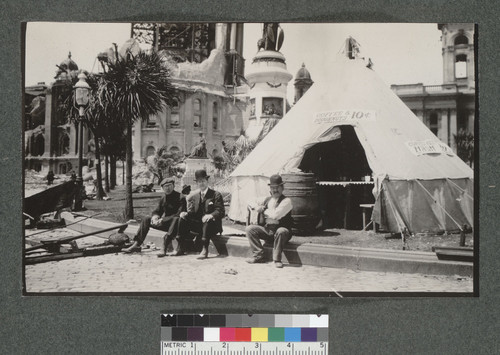 [Makeshift restaurant tent. Ruins of City Hall in distance.]