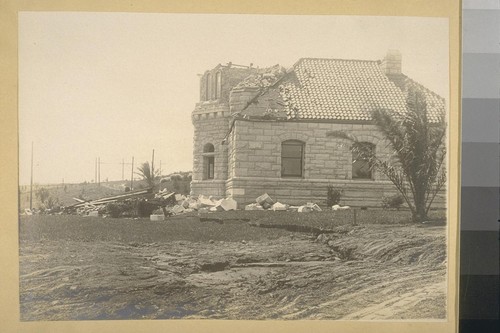 [Earthquake damage to stone building.]