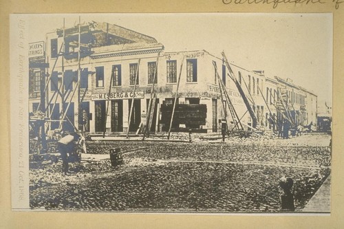 [Store fronts propped up with lumber after 1868 earthquake.]