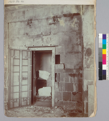 [Interior damage to unidentified building. Opened vault.]