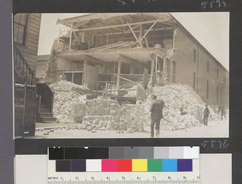 [Clean-up/reconstruction at ruins of masonry building. Unidentified location.]