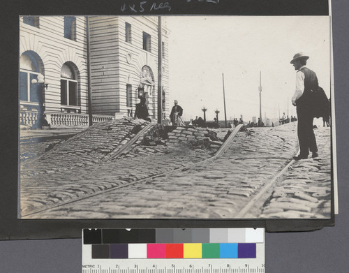 [Swelling of ground beneath Mission Street. Post Office, left.]
