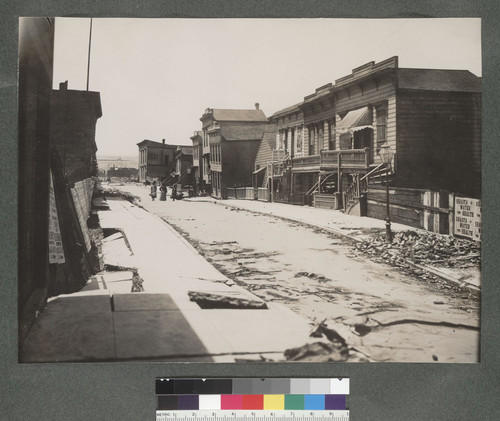 [Dore Street, showing debris and subsided property, left.]