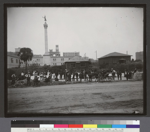 Union Square. [Scene along Geary St. during street city-wide cleaning day. Relief tables and temporary buildings, including Hotel St. Francis (white building left of center).]