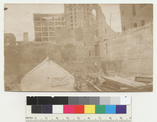 [Tent among ruins. Unidentified location.]