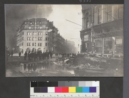 [Intersection of Market and California Sts. flooded from broken water main. Luning Building on left.]