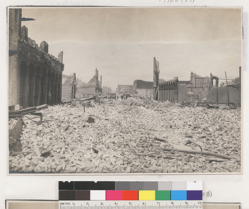 [Ruins and rubble along unidentified street.]