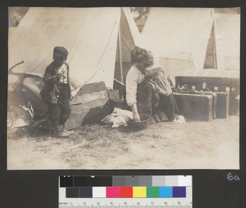 [Woman and children. Unidentified refugee camp.]