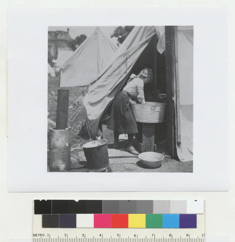 [Woman at wash basin. Unidentified refugee camp.]