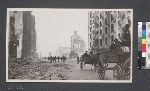 Looking towards the Ferry from Market near Kearny. Ruins of the Grand and Palace Hotels at the right and the air is yet dim with the smoke of the burning building. April 20, 1906