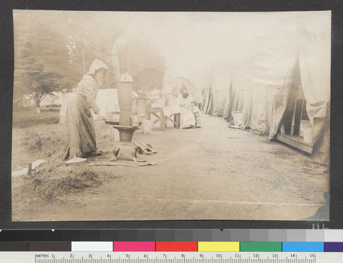 [Woman at street kitchen. Unidentified refugee camp.]