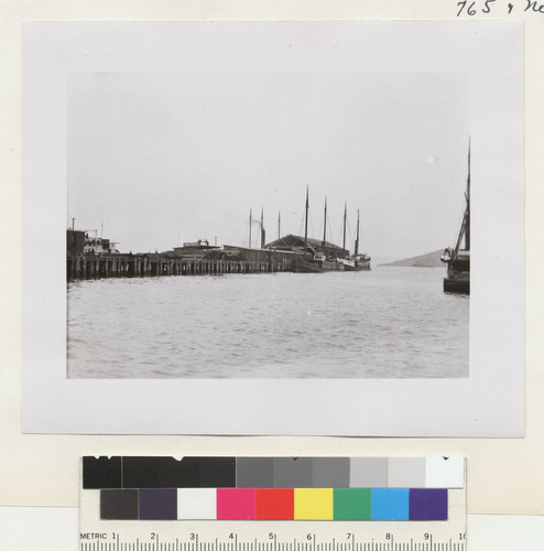 [Pier scene. Boats loaded with cargo for reconstruction?]