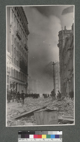 [Montgomery St. looking south toward Market St. during fire. Burning of Palace Hotel in distance.]