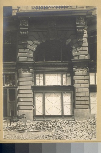 [Flood Building? Exterior detail of street level arch.]