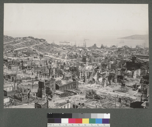 [Panorama from Nob Hill: view to the northeast. Telegraph Hill at left, sloping southward into the Barbary Coast district; Chinatown, foreground; the Wholesale District in distance toward waterfront; ruins of the Hall of Justice, far right, center. A portion of Yerba Buena Island appears in San Francisco Bay, upper left.]