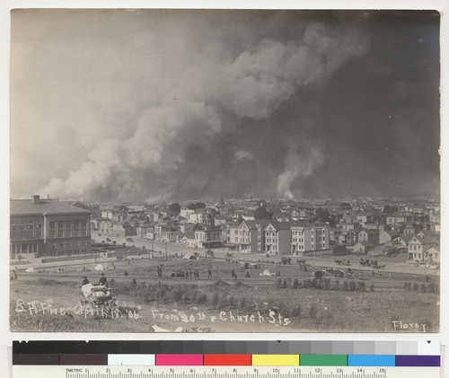 S.F. Fire. April 18. '06. From 20th [Twentieth] and Church Sts. [Mission Dolores Park with refugee tents being constructed, foreground. San Francisco. Photo by Florey.]