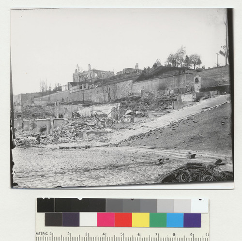 [Ruins along unidentified street.]