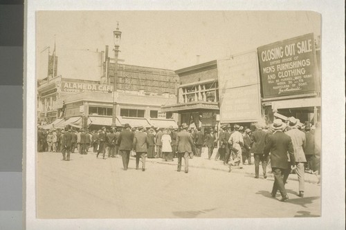 [Crowd gathered around bomb explosion site. Corner of Steuart and Market Streets, San Francisco. During Preparedness Day Parade, July 22, 1916.]