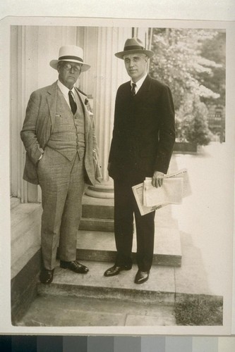 Noted Hearst writer at White House. Wash., D.C.... Arthur Brisbane (left), distinguished writer for the Hearst newspapers, and James T. Williams, Jr., editorial writer, leave the White House after seeing president Hoover. [Reporters covering Thomas Mooney case?] [1932]