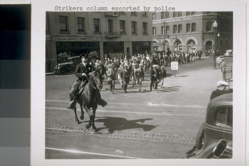 Strikers column escorted by police