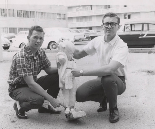 Students pose with the recently abducted fountain statue "Dolores," 1964