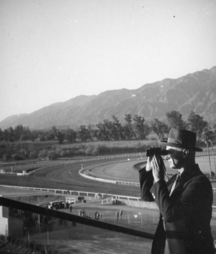 Herman Schultheis with binoculars, Santa Anita Racetrack
