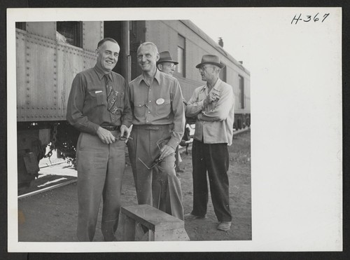 Raymond R. Best (left), Director of the Tule Lake Relocation Center, and Mortimer C. Cooke, Supply Officer. Cooke was in charge of loading and unloading of trains at the center. Photographer: Mace, Charles E