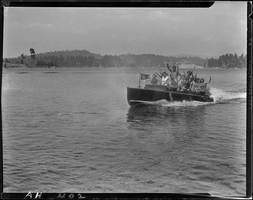 Young people in motorboat "Graceful" on lake, Lake Arrowhead, 1929