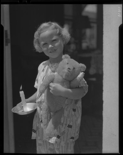 Girl with teddy bear and candle, Los Angeles, circa 1935