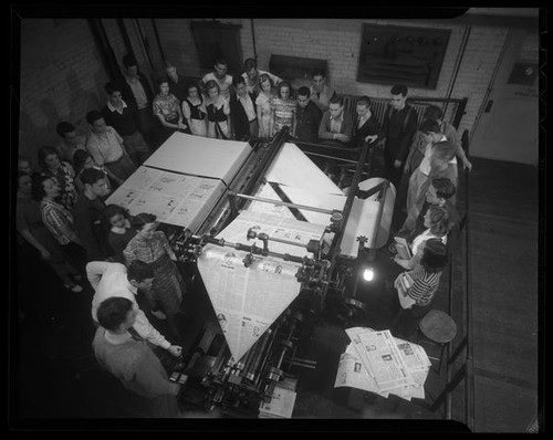 Students watching printing press at Los Angeles City College, Los Angeles, circa 1933-1938