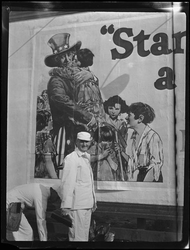 William Gibbs McAdoo and sign painter at billboard, Los Angeles, 1925 or 1927