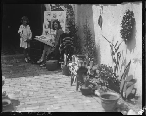 Carolyn Bartlett and artist, Olvera Street, Los Angeles, 1931