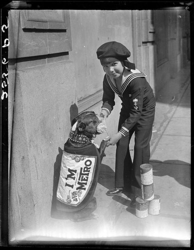 Child actor Jackie Coogan with cans of condensed milk, [1924]