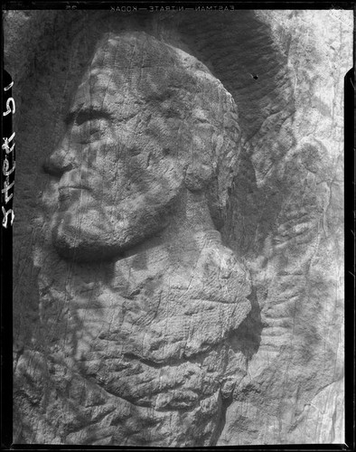 Rock carving of Abraham Lincoln above cave entrance, Los Angeles, 1930