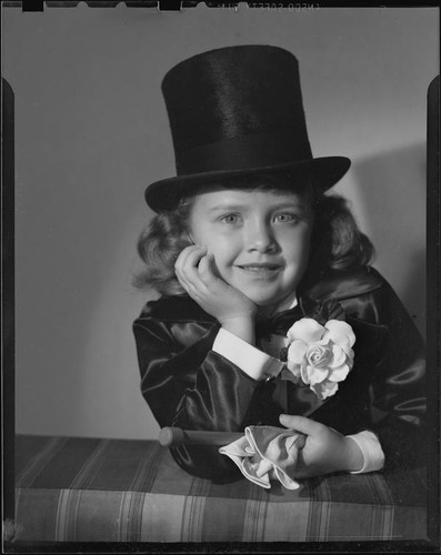 Helena Burnett in tuxedo costume and top hat, 1947-1950