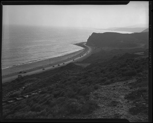 Coastal view down slope towards road construction in the Rancho Malibu la Costa development, Malibu, circa 1927