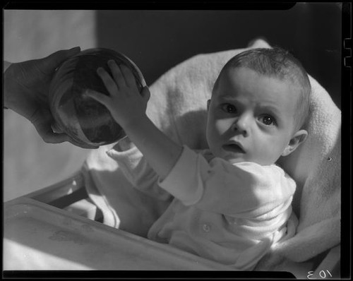 Baby with ball, Los Angeles, circa 1935