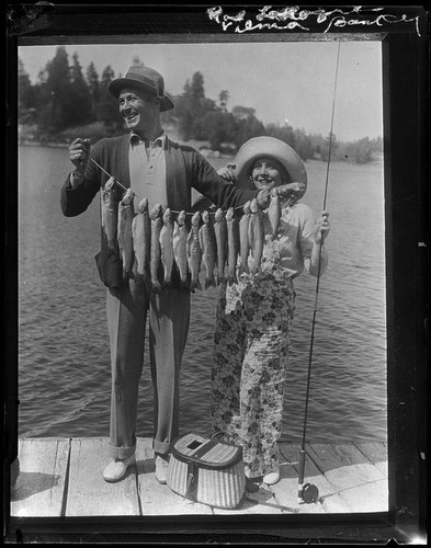 Actors Rod La Rocque and Vilma Banky with fish, Lake Arrowhead, 1929