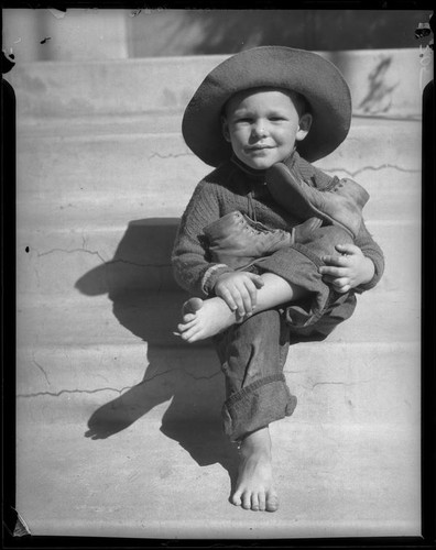 Child seated on steps, Los Angeles, circa 1935