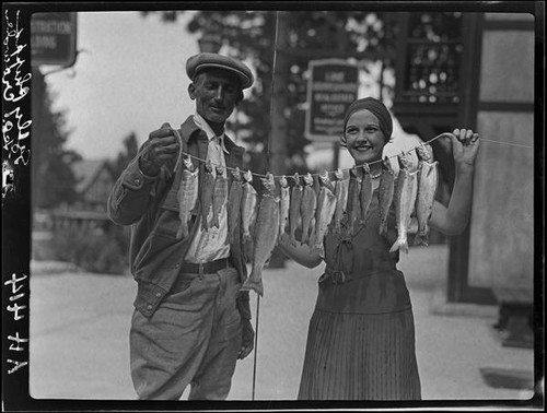 George Crowder and Sally Phipps with string of trout, Lake Arrowhead, 1929