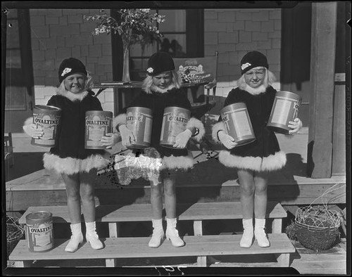 Mawby triplets holding cans of Ovaltine, Malibu, 1928