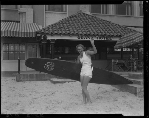 Swimmer Helene Madison with surfboard at Grand Hotel, Santa Monica, 1933