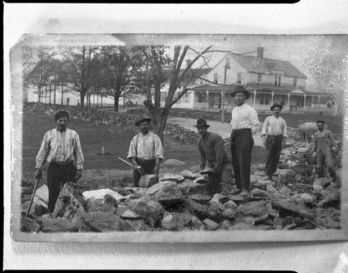 Men building rock wall, [1920s?, rephotographed 1940s?]