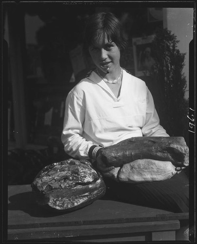 Woman with petrified wood, Palos Verdes Estates, 1930 or 1931