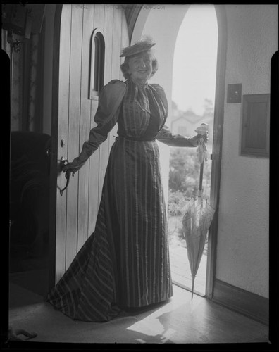 Lucille S. King, actress and ventriloquist, in the doorway of the Bartlett residence, 1951