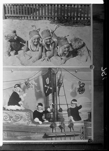 Mawby triplets lying in sand and playing on pirate boat, Santa Monica, 1929