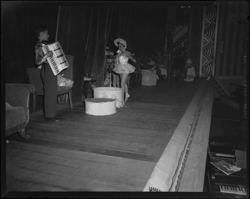 Child ballerina and accordian player perform with ventriloquist Lucille King, 1951