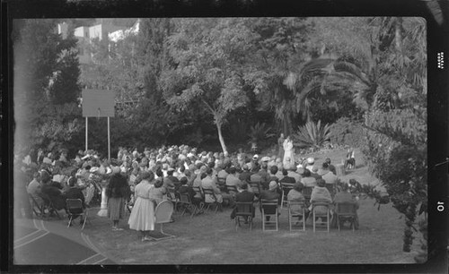 Audience watching outdoor theatrical performance, perhaps Shakespeare, [Santa Monica?], 1956-1957