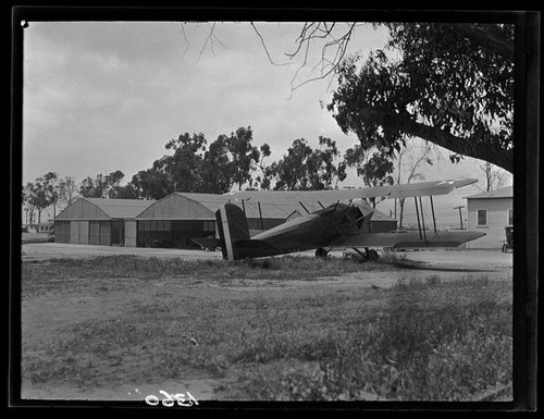 Biplane at airfield, [1920s?]